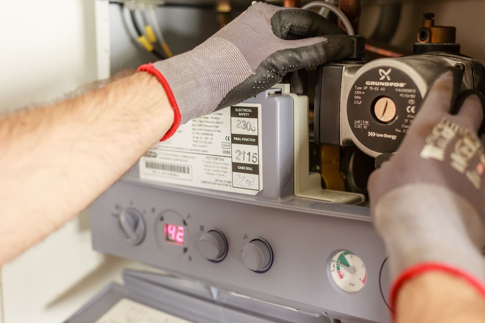 Plumbing technician servicing a residential water heater